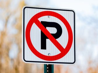 Red and white no parking sign