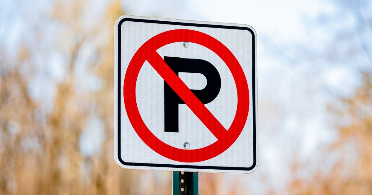 Red and white no parking sign