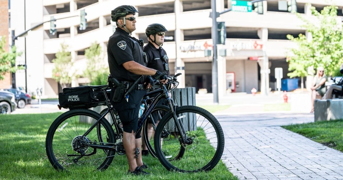 Boise police on bikes in front of parking structure