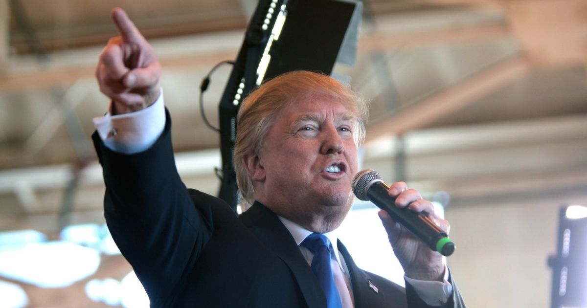 Donald Trump speaking with supporters at a hangar at Mesa Gateway Airport in Mesa, Arizona.