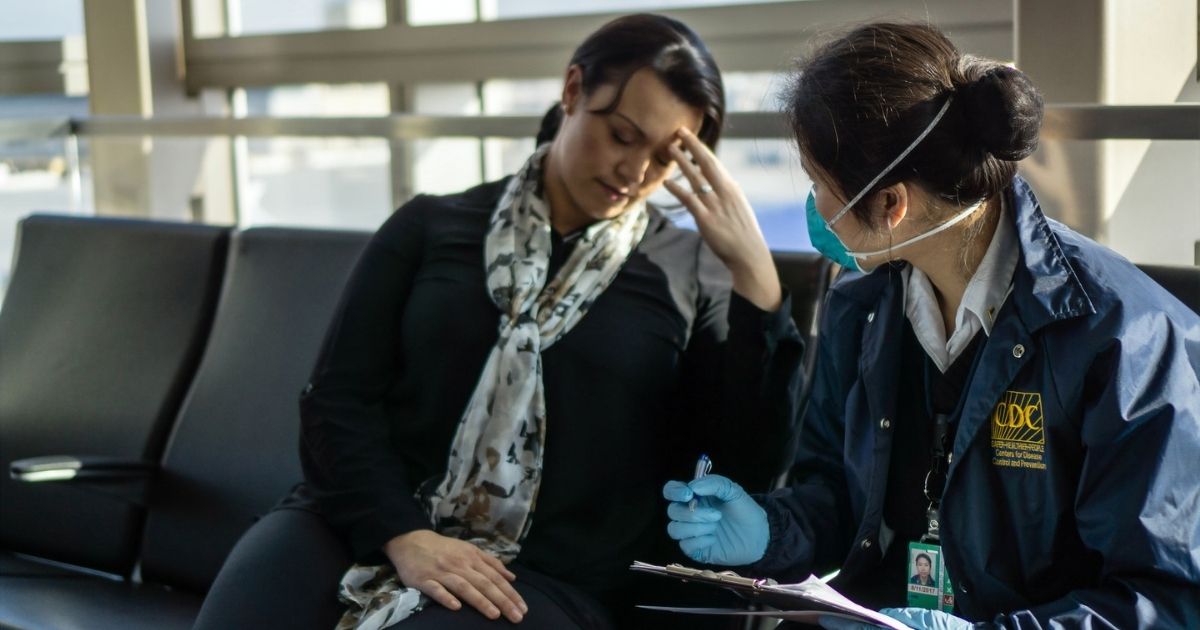 Centers for Disease Control and Prevention (CDC), Quarantine Station staff, respond to reports of sick travelers at 18 United States international airports, and land ports of entry, where most international travelers arrive. Here, CDC Quarantine, Public Health Officer, Diana Lu, was assessing a sick traveler, who had just arrived at the Los Angeles International Airport from another country. She is trained to ask such questions as: “When did the fever start? Any other symptoms?