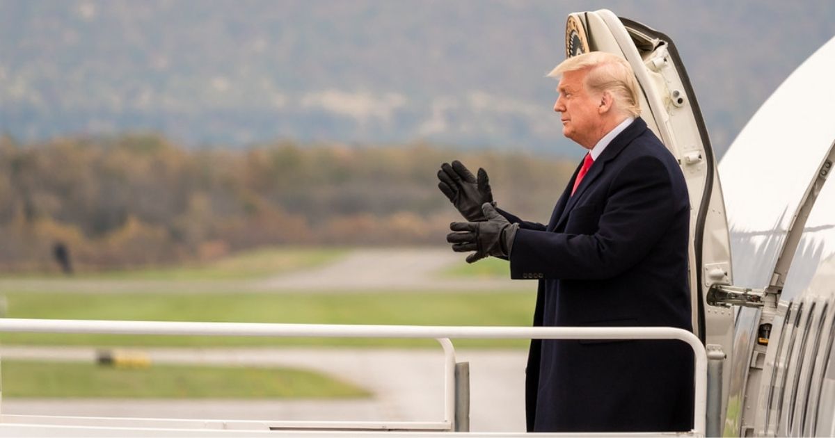 President Donald J. Trump applauds the crowd and gestures with a fist pump as he disembarks Air Force One Saturday, Oct. 31, 2020, upon his arrival to Reading Regional Airport in Reading, Pa., the second of President Trump’s 4 stops in Pennsylvania.
