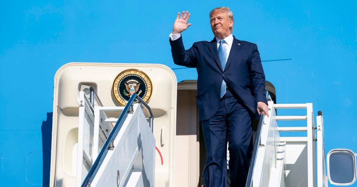 President Donald J. Trump waves as he disembarks Air Force One Wednesday, Oct. 21, 2019, at Pittsburgh International Airport in Pittsburgh. (Official White House Photo by Tia Dufour)