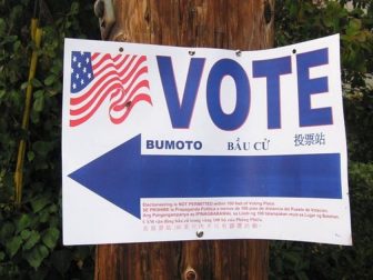 A "Vote" sign is seen above.