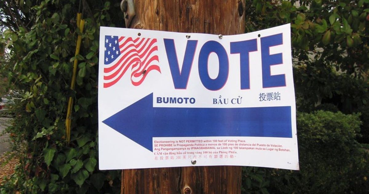 A "Vote" sign is seen above.