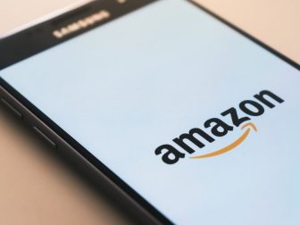 Black smartphone displaying Amazon logo