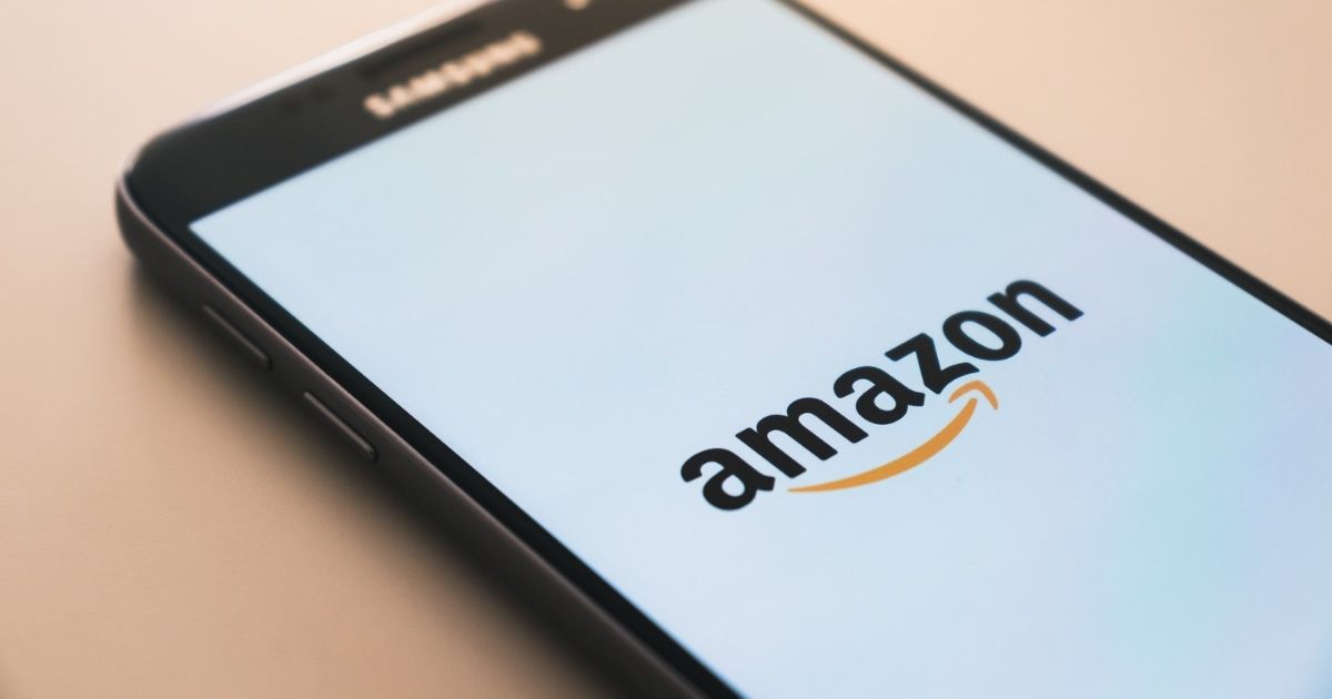 Black smartphone displaying Amazon logo