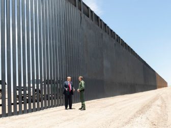 President Donald J. Trump meets U.S. Border Patrol Chief Rodney Scott as he walks along the completed 200th mile of new border wall Tuesday, June 23, 2020, along the U.S.-Mexico border near Yuma, Ariz. (Official White House Photo by Shealah Craighead)