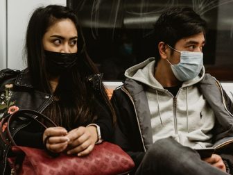 A young couple in face masks riding the subway in Rome, Italy during the Covid-19 pandemic