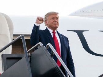 President Donald J. Trump offers a fist-pump to an awaiting crowd as he steps from Air Force One Friday, Aug. 28, 2020, upon his arrival to Manchester-Boston Regional Airport in Manchester, N.H. (Official White House Photo by Joyce N. Boghosian)