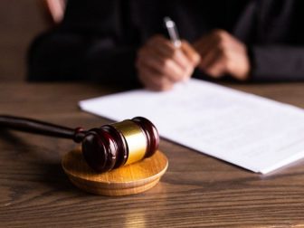 Wooden gavel on a wood table