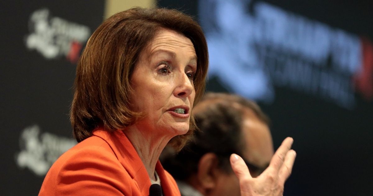 Minority Leader Nancy Pelosi speaking with attendees at a Trump Tax Town Hall hosted by Tax March at Events on Jackson in Phoenix, Arizona.