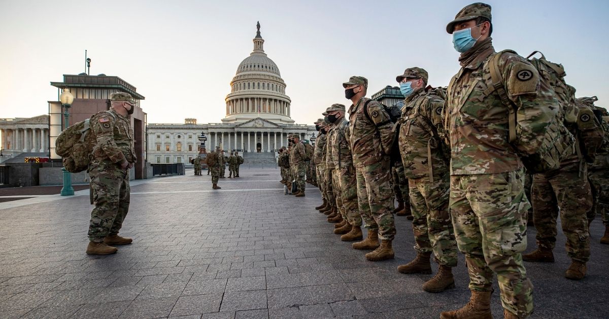 New Jersey National Guard Soldiers and Airmen from 1st Battalion, 114th Infantry Regiment, 508th Military Police Company, 108th Wing, and 177th Fighter Wing arrive near the Capitol to set up security positions in Washington, D.C., Jan. 12, 2021. National Guard Soldiers and Airmen from several states have traveled to Washington to provide support to federal and district authorities leading up to the 59th Presidential Inauguration. (U.S. Air National Guard photo by Master Sgt. Matt Hecht)