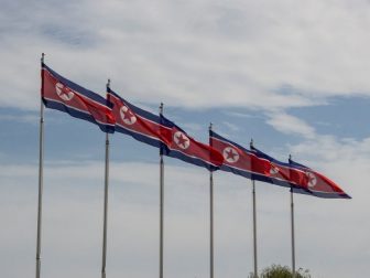 North Korean flags flying