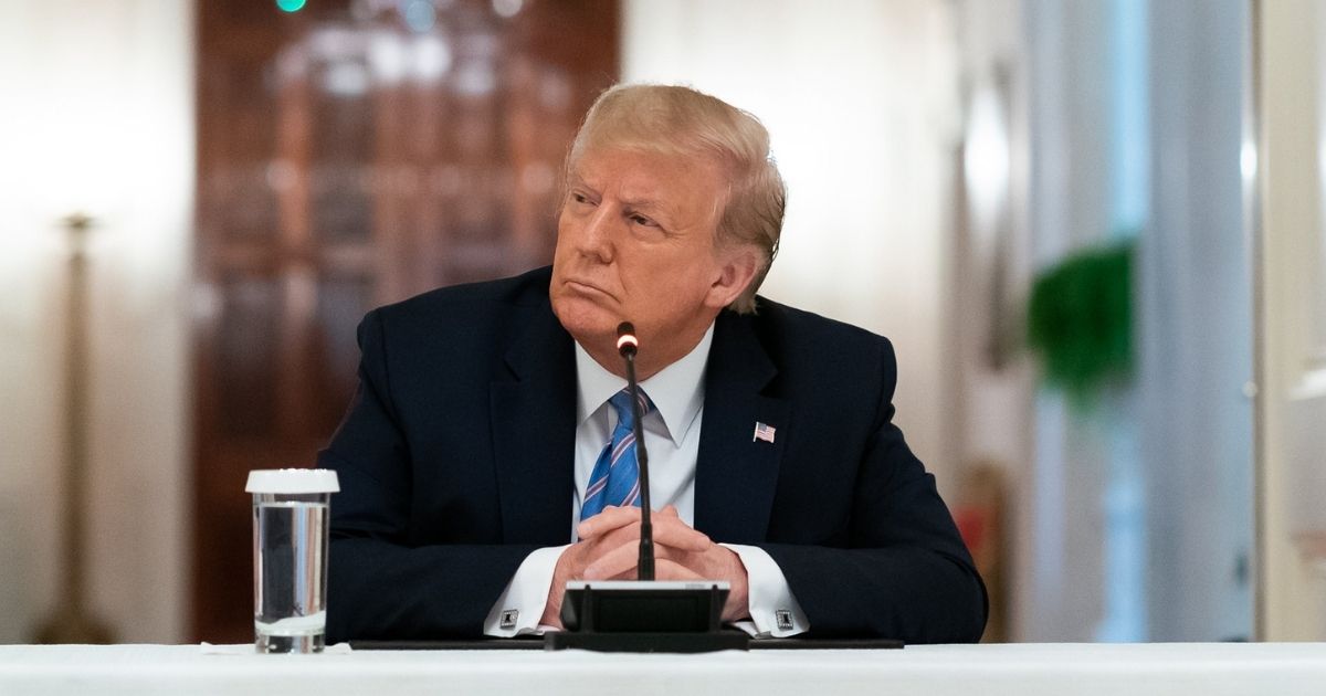 President Donald J. Trump listens to participants deliver remarks during the National Dialog on Safely Reopening America's Schools event Tuesday, July 7, 2020, in the East Room of the White House. (Official White House Photo by Andrea Hanks)