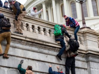 Protesters scaling wall at Capitol