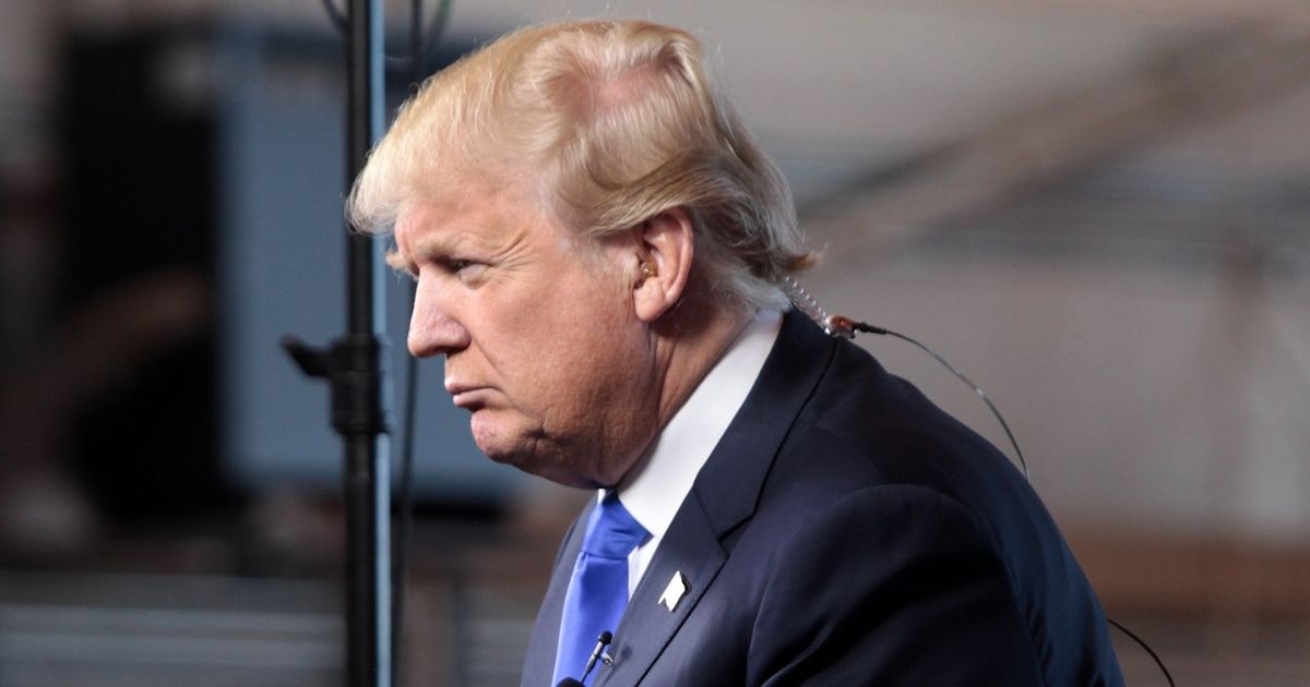 Donald Trump speaking with the media at a hangar at Mesa Gateway Airport in Mesa, Arizona.