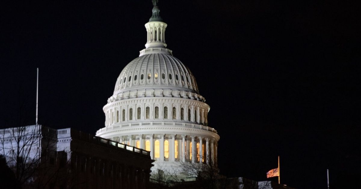 The U.S. flag flies at half-staff outside the U.S. Capitol Monday evening, Dec. 3, 2018, as former President George H. W. Bush lies in state in the Rotunda of the U.S. Capitol in Washington, D.C. (Official White House Photo by Shealah Craighead)