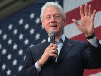 Former President Bill Clinton speaking with supporters at a campaign rally for his wife, former Secretary of State Hillary Clinton, at Central High School in Phoenix, Arizona.