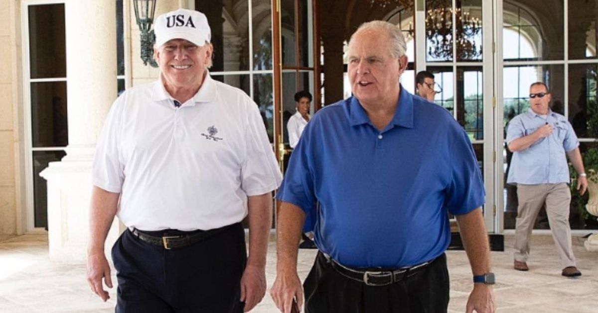 Former President Donald Trump and former radio commentator Rush Limbaugh walk together on April 19, 2019, following their round of golf at the Trump International Golf Club in West Palm Beach, Florida.