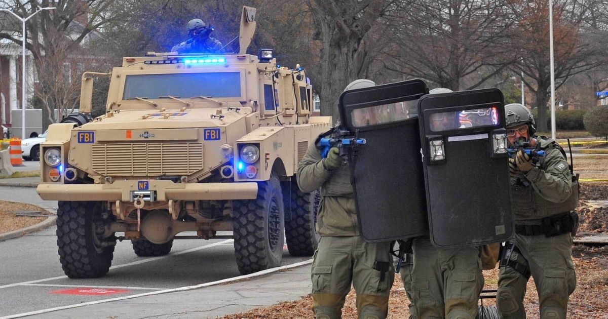 NORFOLK (Feb. 11, 2015) An FBI SWAT team provides integrated training assistance during Solid Curtain-Citadel Shield at Naval Station Norfolk. Solid Curtain-Citadel Shield is an annual force protection and anti-terrorism exercise designed to enhance the training and readiness of Navy security forces to respond to threats to installations and units. (U.S. Navy photo by Mass Communication Specialist 2nd Class Justan Williams/Released)