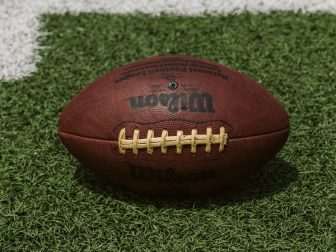 Brown Wilson football on a field