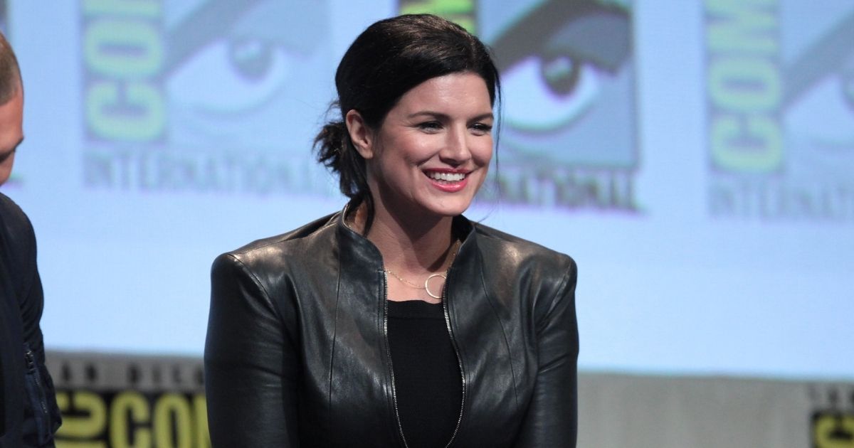 Ed Skrein and Gina Carano speaking at the 2015 San Diego Comic Con International, for "Deadpool", at the San Diego Convention Center in San Diego, California.