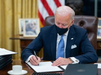 President Joe Biden signs one of the 17 Executive Orders he signed on Inauguration Day Wednesday, Jan. 20, 2021, in the Oval Officeof the White House. (Official White House Photo by Adam Schultz)