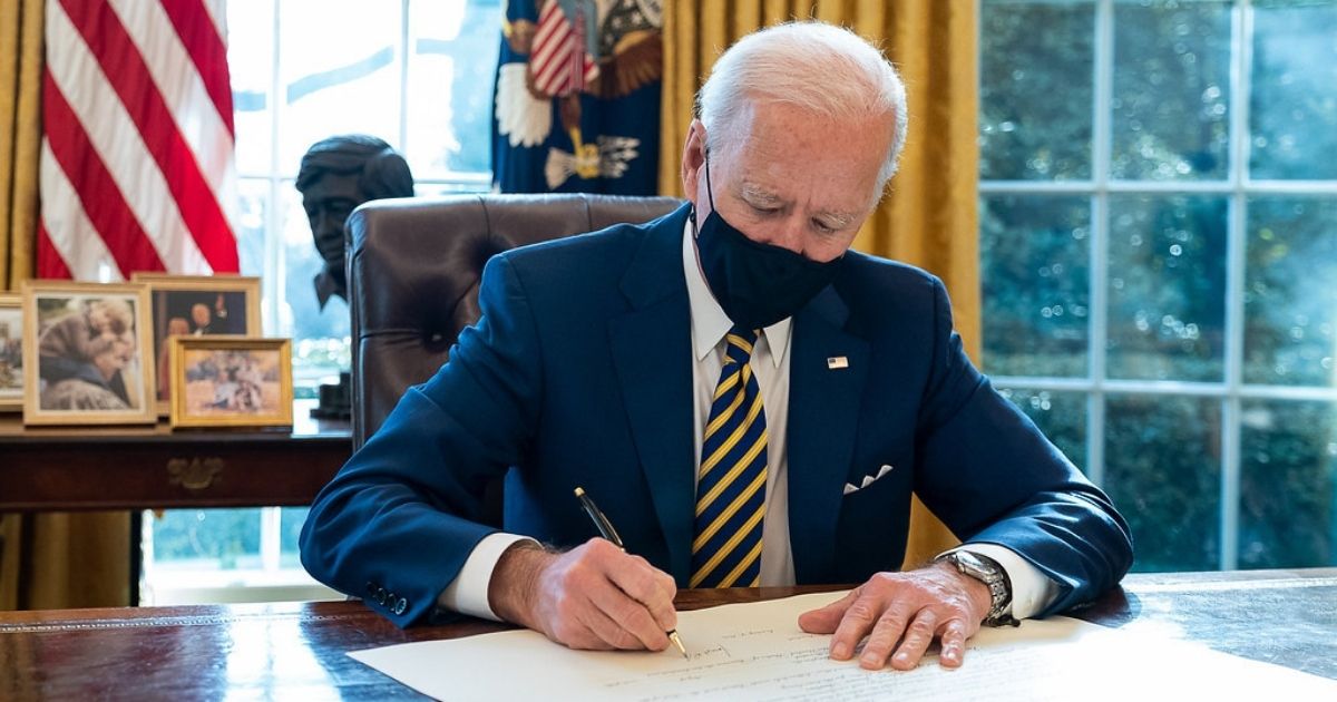 President Joe Biden signs the commission for Lloyd Austin to be Secretary of Defense Friday, Jan. 22, 2021, in the Oval Office of the White House. Lloyd Austin is the first black Secretary of Defense. (Official White House Photo by Adam Schultz)