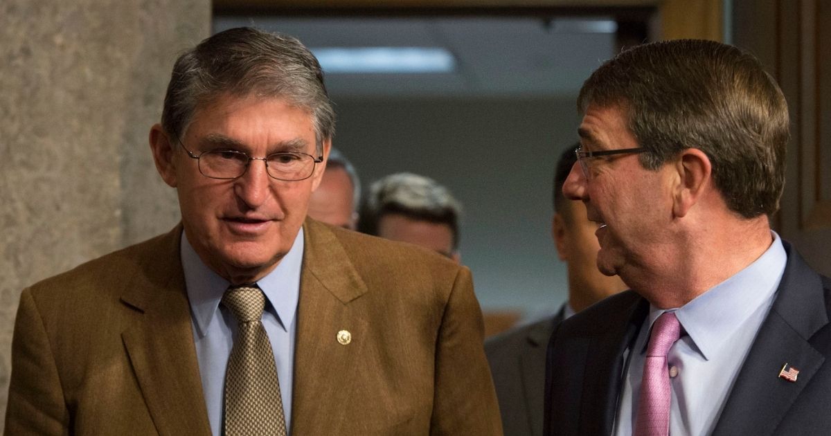 Secretary of Defense Ash Carter speaks with U.S. Senator for West Virginia, Joe Manchin as Carter arrives to testify before the Senate Armed Services Committee on U.S. military strategy in the Middle East Oct. 27, 2015. (Photo by Senior Master Sgt. Adrian Cadiz)