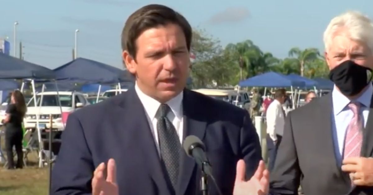 Republican Gov. Ron DeSantis of Florida discusses the possibility of a travel ban being implemented in the state on Thursday during a news conference.