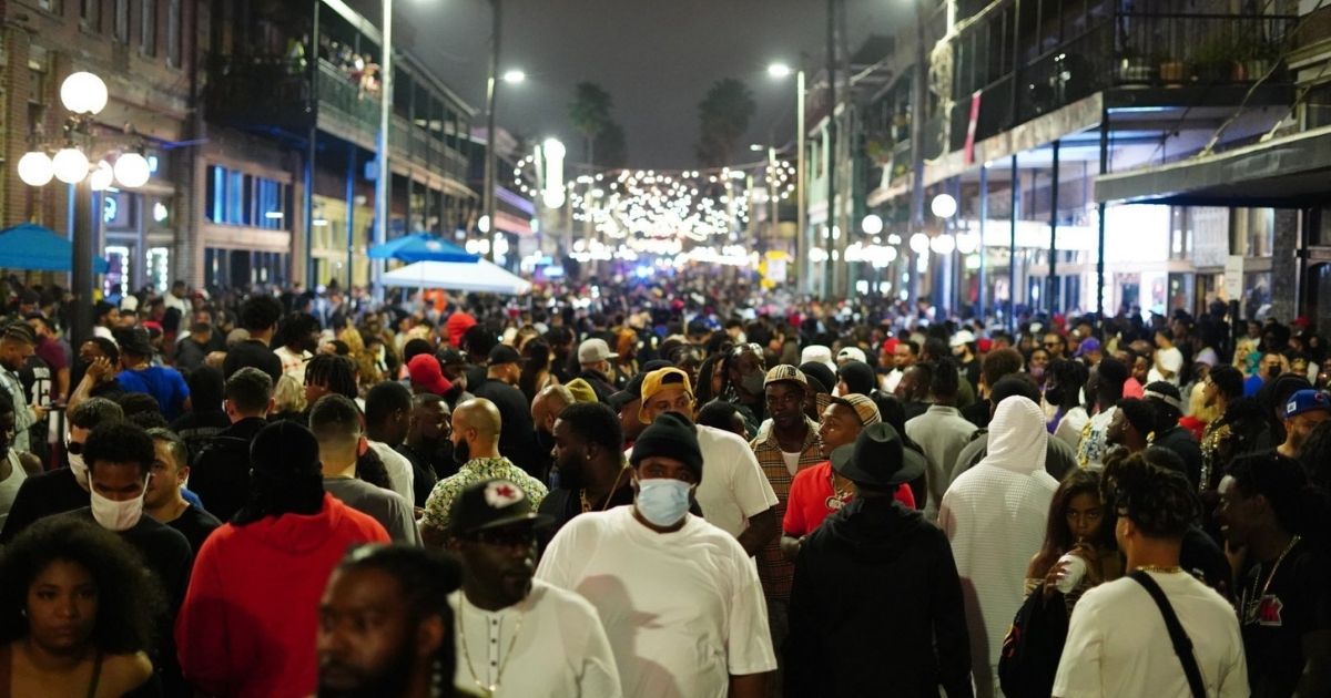 A crowd gathers after the Super Bowl LV in Tampa, Florida on Sunday.