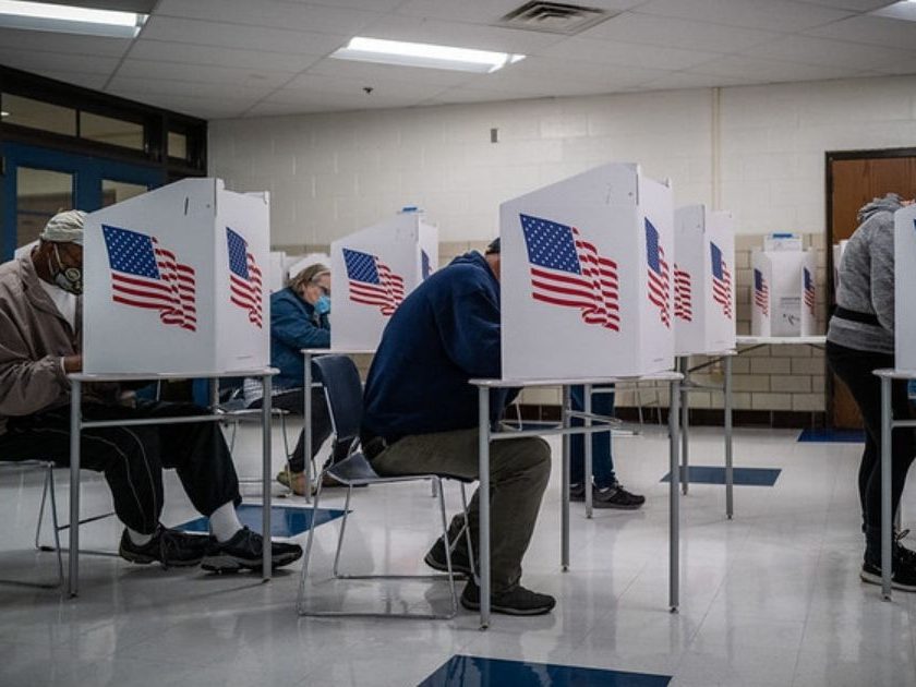 People vote at Callanan Middle School in Des Moines Township, Iowa.