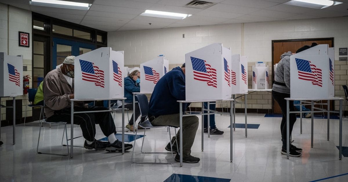 People vote at Callanan Middle School in Des Moines Township, Iowa.