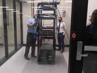 Auditors examine a vote tabulation machine to determine the machine's accuracy and reliability.