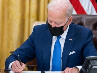 President Joe Biden signs executive orders on immigration Tuesday, Feb. 2, 2021, in the Oval Office of the White House. (Official White House Photo by Adam Schultz)