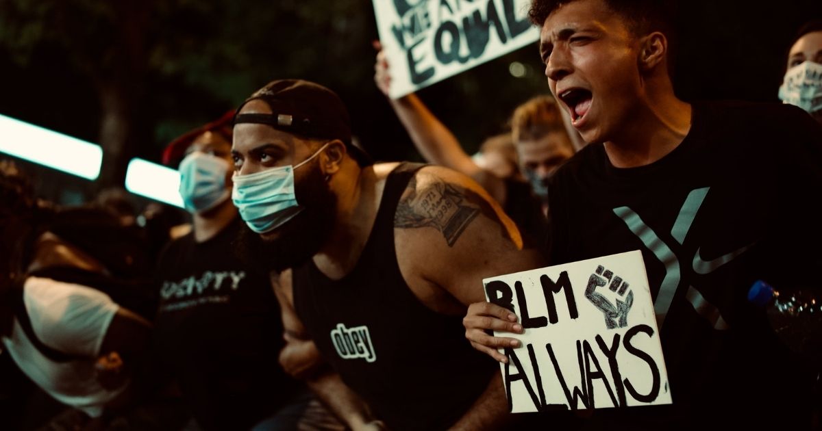 BLM protesters holding signs