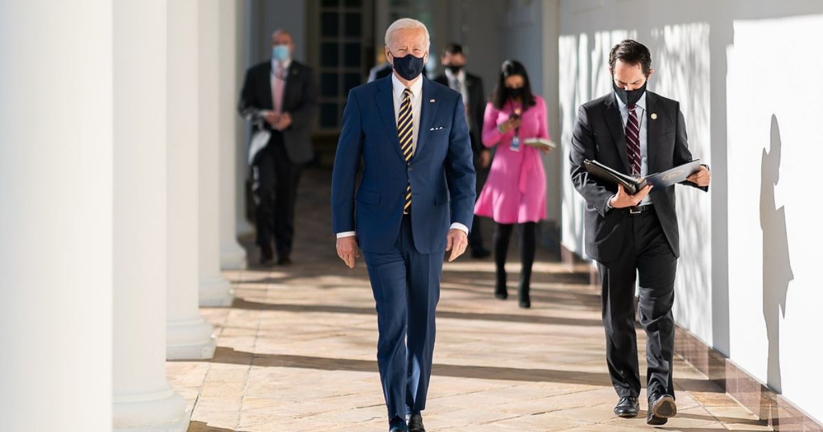 President Joe Biden walks with his personal aide Stephen Goepfert along the Colonnade Friday, Jan. 22, 2021, to a briefing on the economy in the State Dining Room of the White House. (Official White House Photo by Adam Schultz)