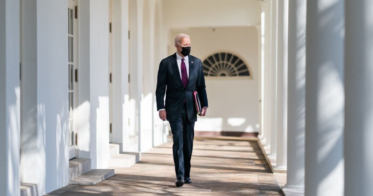 President Joe Biden walks along the Colonnade of the White House Tuesday, Feb. 23, 2021, to the Oval Office. (Official White House Photo by Adam Schultz)