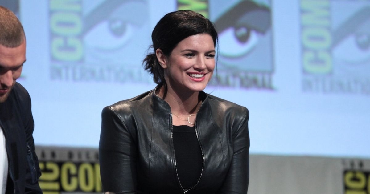 Ed Skrein and Gina Carano speaking at the 2015 San Diego Comic Con International, for "Deadpool", at the San Diego Convention Center in San Diego, California.