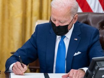 President Joe Biden signs executive orders on immigration Tuesday, Feb. 2, 2021, in the Oval Office of the White House. (Official White House Photo by Adam Schultz)