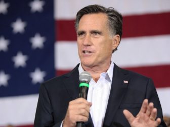 Former Governor Mitt Romney speaking with supporters at a campaign rally for U.S. Senator John McCain at Dobson High School in Mesa, Arizona.
