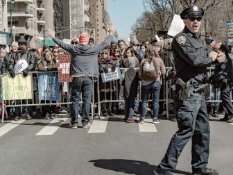 Demonstrators gather and wait for the “March for our lives protest” today in New York City.