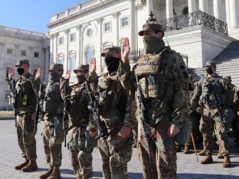 From left: U.S. Army 1st Sgt. Michael Thompson, Spc. Michael Kemerer, Spc. Joseph Haefner, Spc. Daniel Althoff, and Spc. Adam Biemiller, all with Company A, 1st Battalion, 175th Infantry Regiment, Maryland National Guard, swear their oaths of reenlistment outside of the U.S. Capitol building in Washington, D.C., Jan. 22, 2021. At least 25,000 National Guard men and women have been authorized to conduct security, communication and logistical missions in support of federal and District authorities leading up to and through the 59th Presidential Inauguration. (U.S. Army National Guard photo by Capt. Brendan Cassidy)