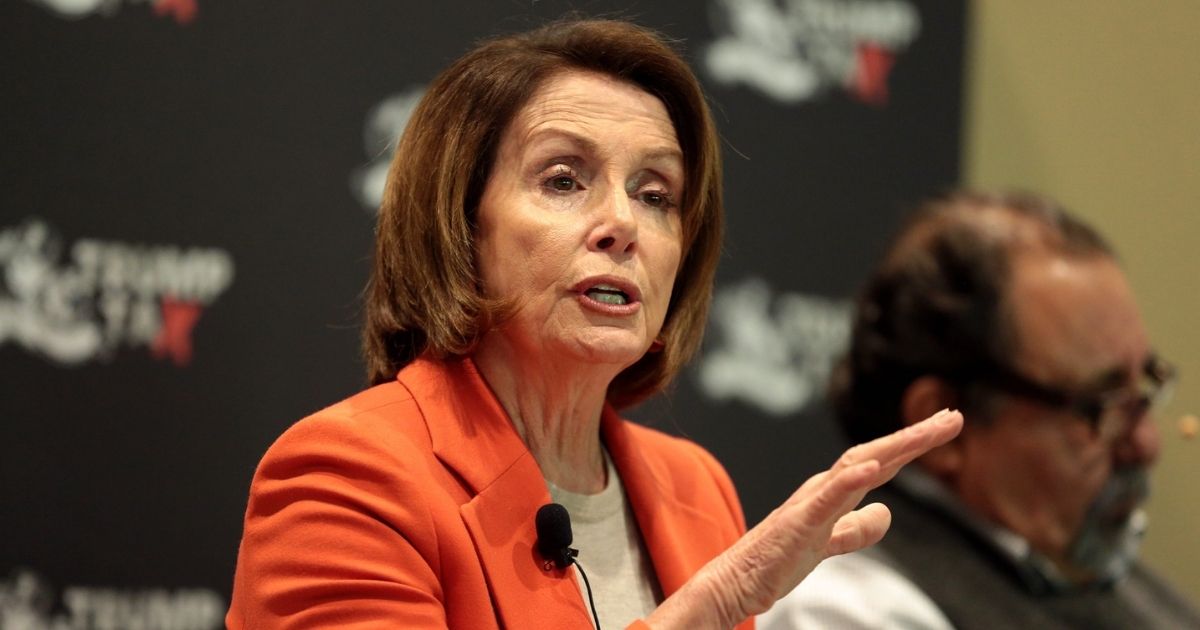 Minority Leader Nancy Pelosi speaking with attendees at a Trump Tax Town Hall hosted by Tax March at Events on Jackson in Phoenix, Arizona.