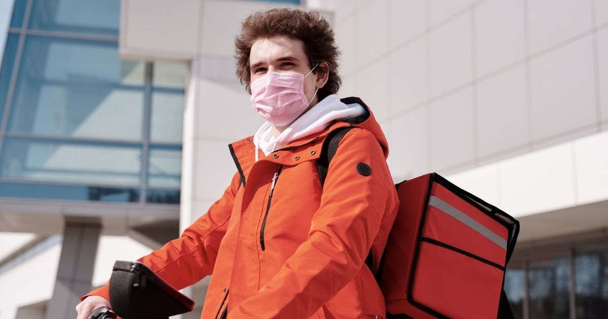 Man on bike wearing a mask