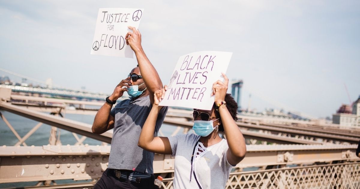 Protesters holding signs