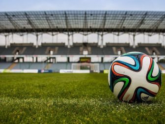 Colorful soccer ball on the field of a stadium