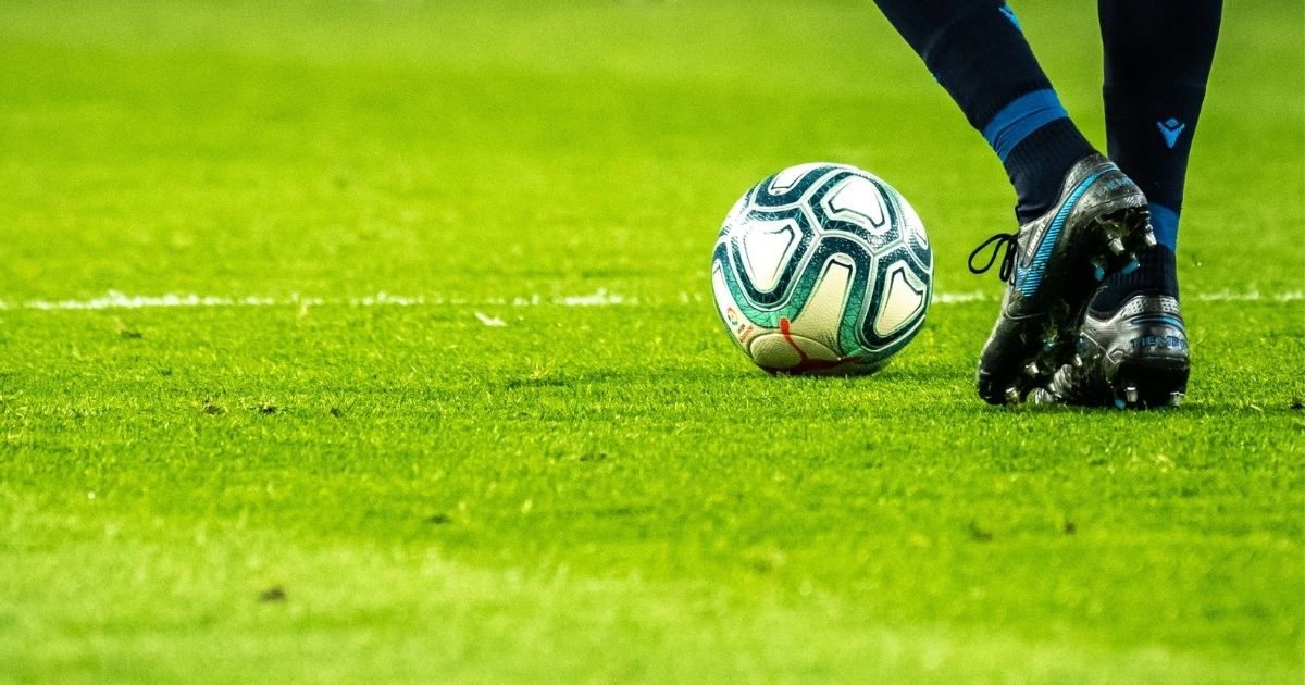 Man playing soccer on a field