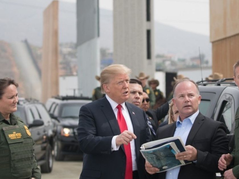 Then-President Donald Trump reviews U.S. Customs and Border Protection's wall prototypes on the border in Otay Mesa, California, on March 13, 2018.